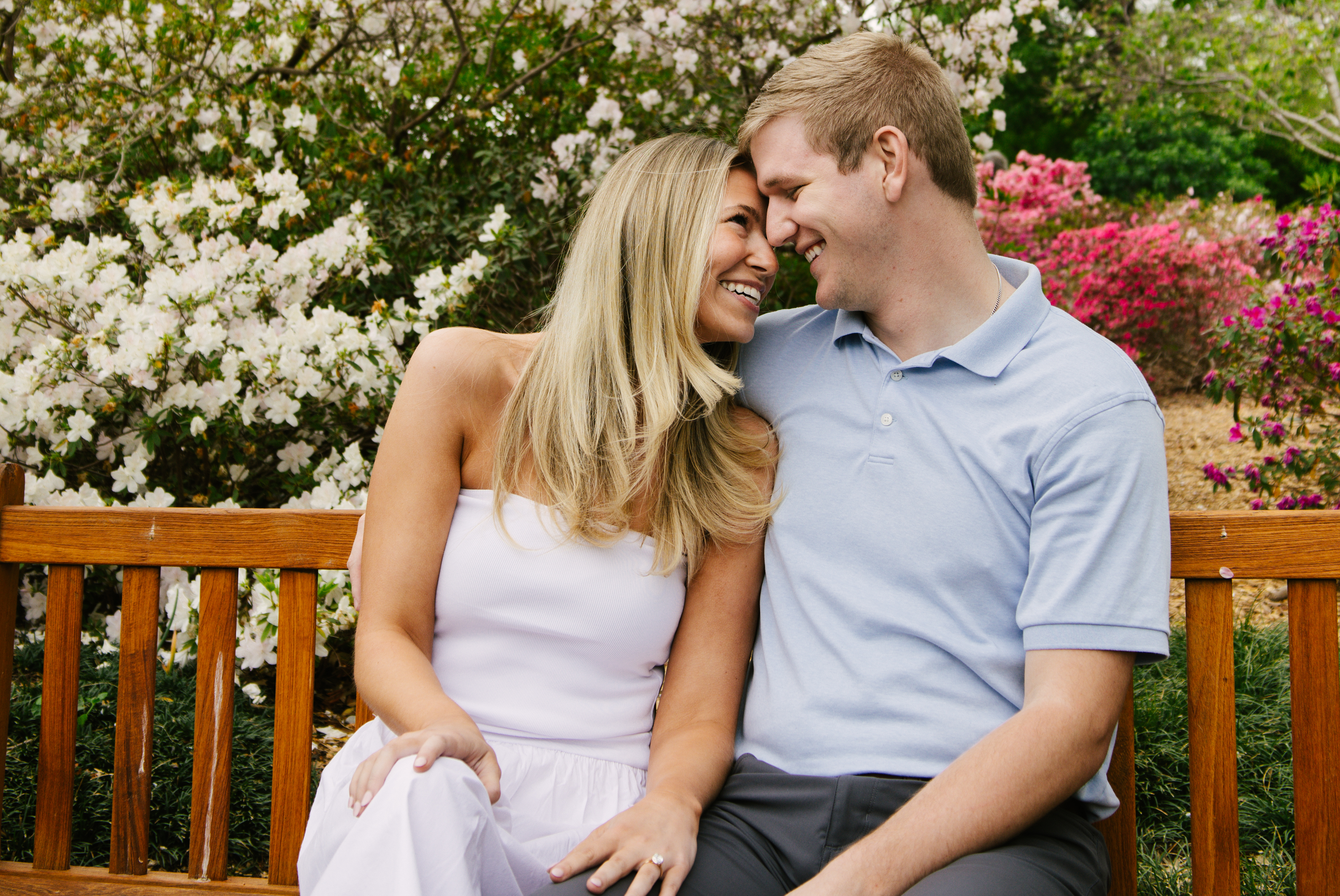 Olivia and Ethan smiling on a bench